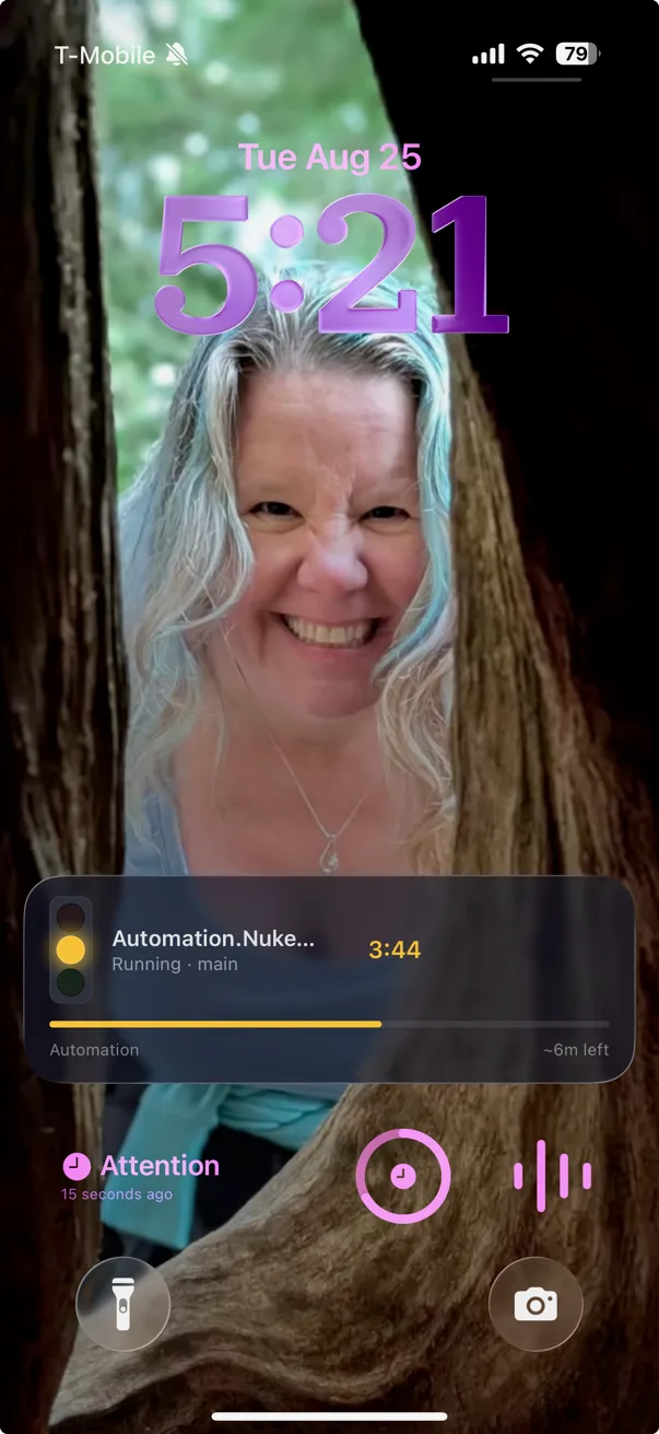 An iPhone Lock Screen showing the time and a Greenlight Live Activity two thirds of the way down: an amber stoplight beside the pipeline name Automation.Nuke, running on main, a timer reading 3:44, a progress bar and an estimate of six minutes remaining.